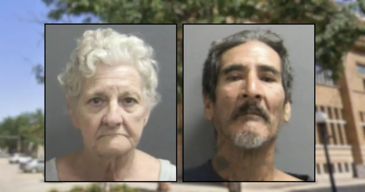 2 people dragged a dead body through their apartment lobby and propped him up in a chair by the elevator
