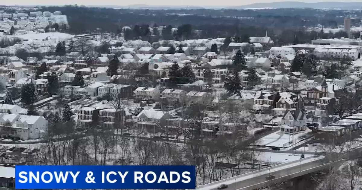 Phoenixville , Pa . crews tackle heavy weekend snowfall as residents dig out and play