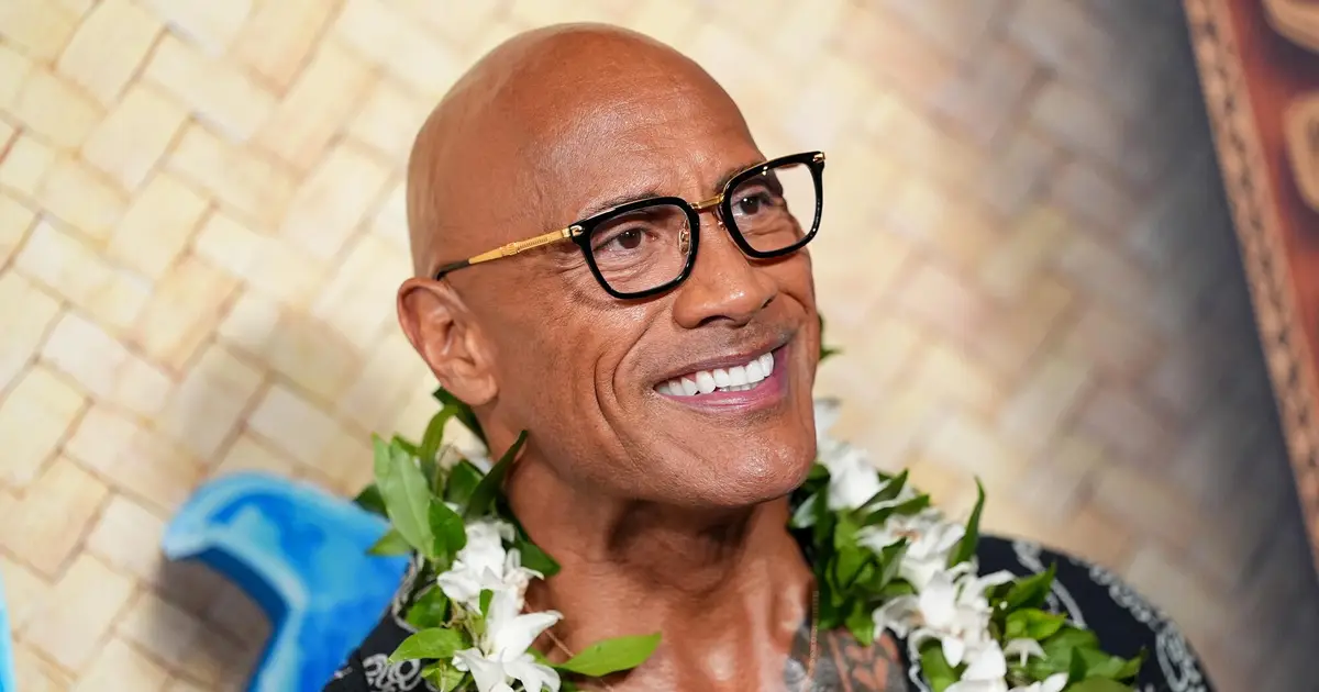 Dwayne Johnson Describes ‘Lizard Music’ As “‘Willy Wonka’ From The Mind Of Benny Safdie,” Details 5-Hour Makeup Process To Play 70-Year-Old — D23