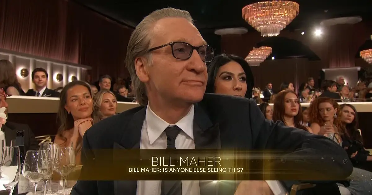 Bill Maher looks stone - faced as Wanda Sykes mockingly begs him to  do les at 2026 Golden Globes