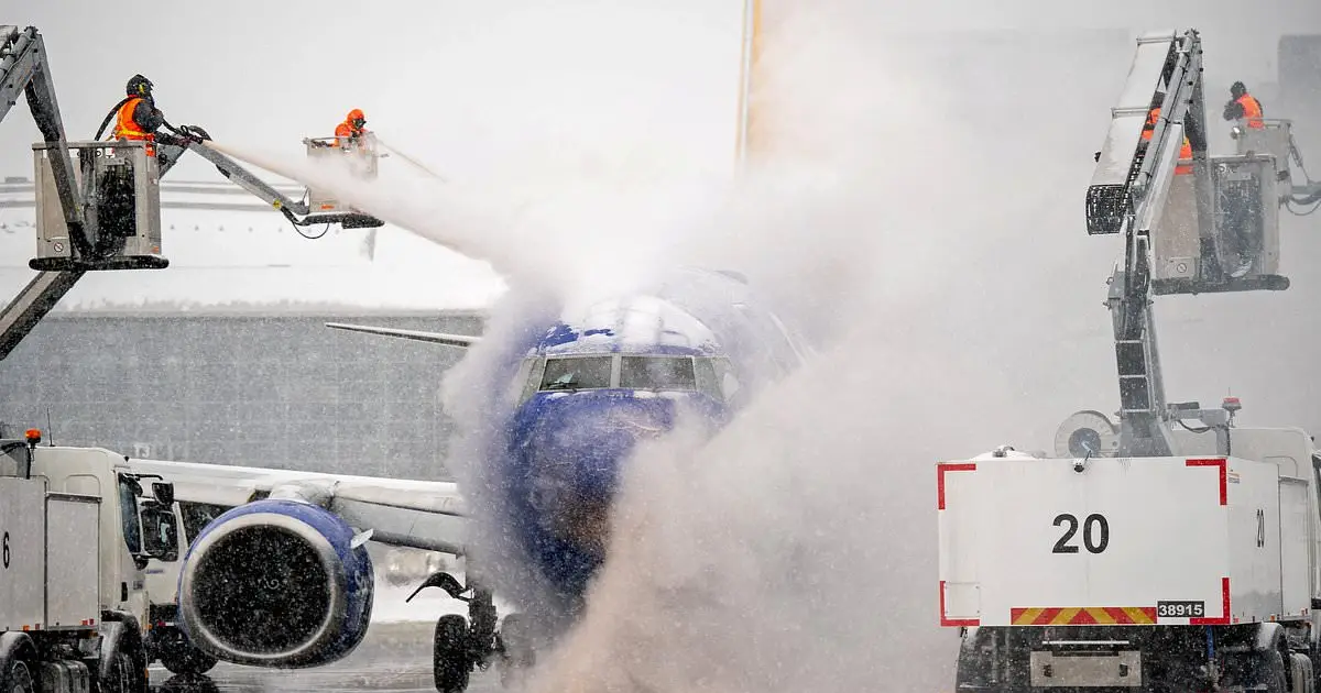 Winter storm hell sees major city grind to a halt under six inches of snow as 12 , 000 flights canceled - and the worst is still to come