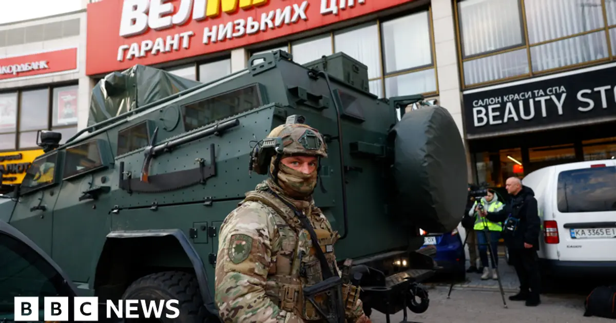 At least six killed in Kyiv as gunman opens fire and takes hostages