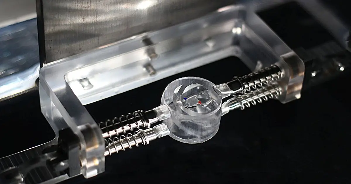 Water-surface vortices drive tiny rotors without electricity, magnets or chemicals