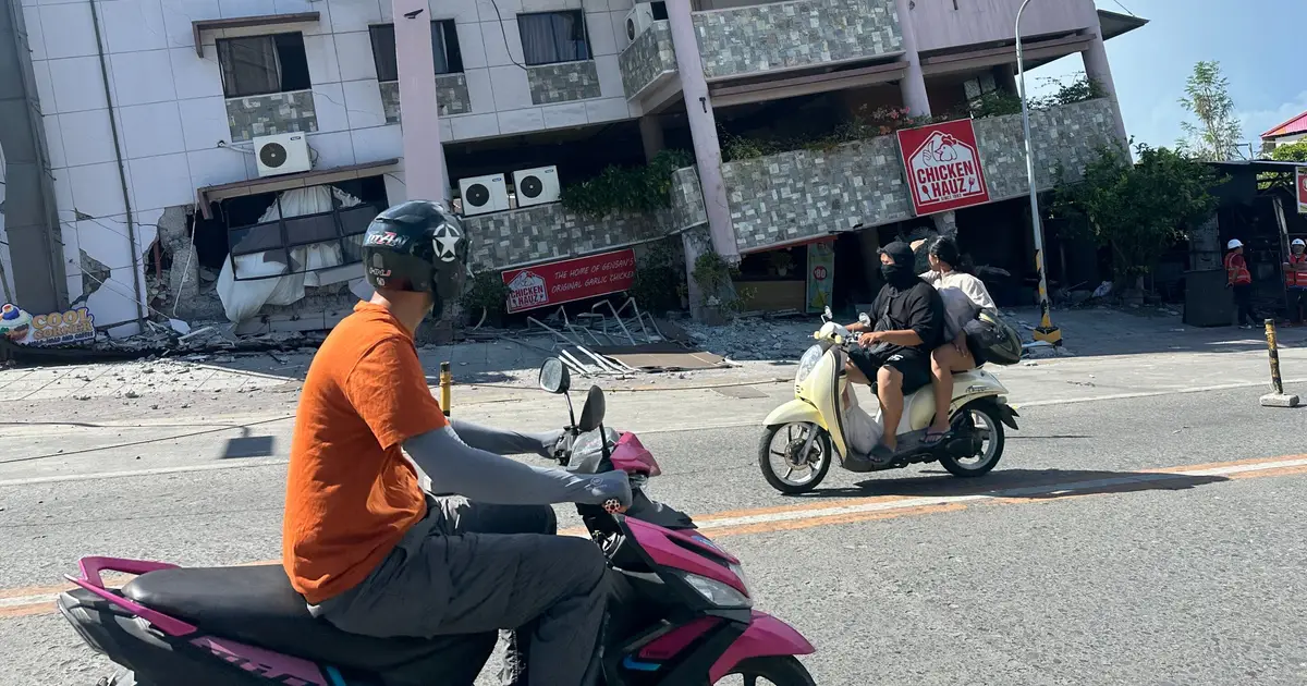 A 7.8 magnitude quake in the Philippines kills at least 19, fells buildings and sets off a tsunami
