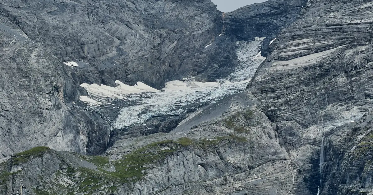 A looming rock collapse threatens a Swiss village as thawing permafrost destabilizes the Alps