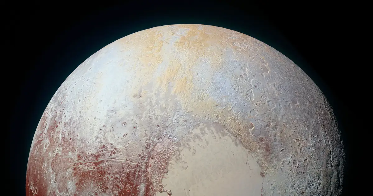 Titan and Pluto exhibit the same mysterious spectral feature—and researchers can't figure out its origin