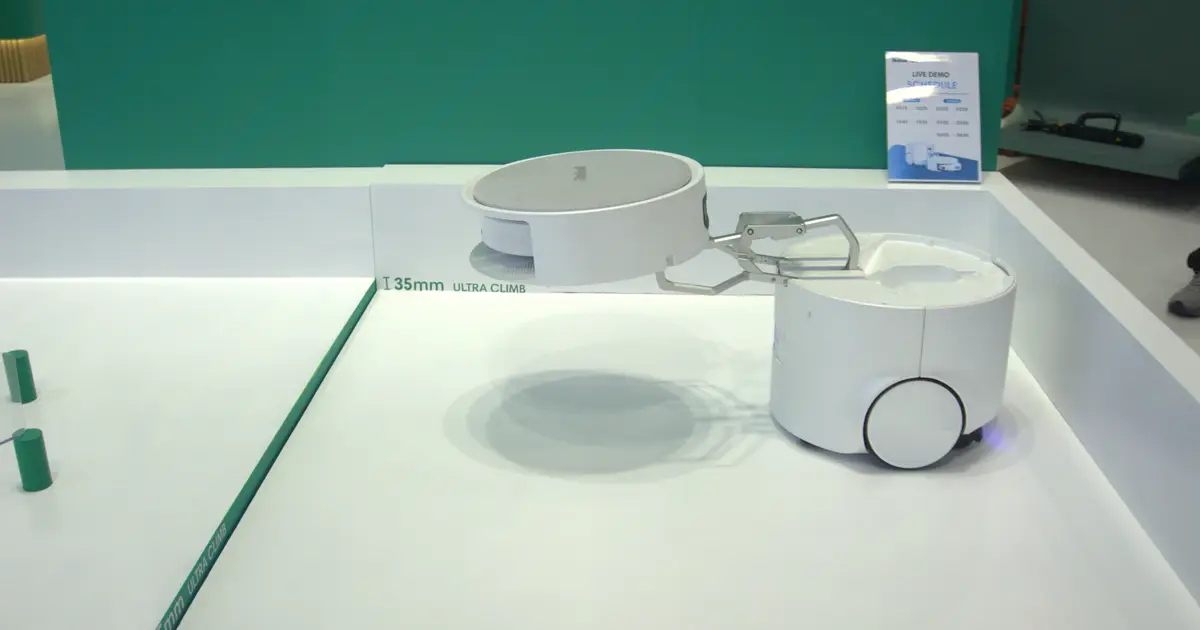 I Watched a Floor Washing Robot Mothership Deploy a Roomba Using a Mechnical Arm