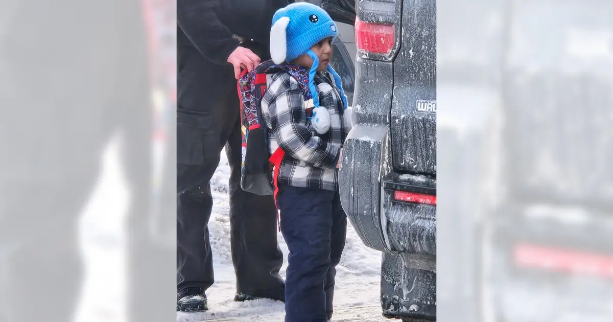 Judge issues temporary order barring removal of boy , 5 , and father who were detained in Minnesota